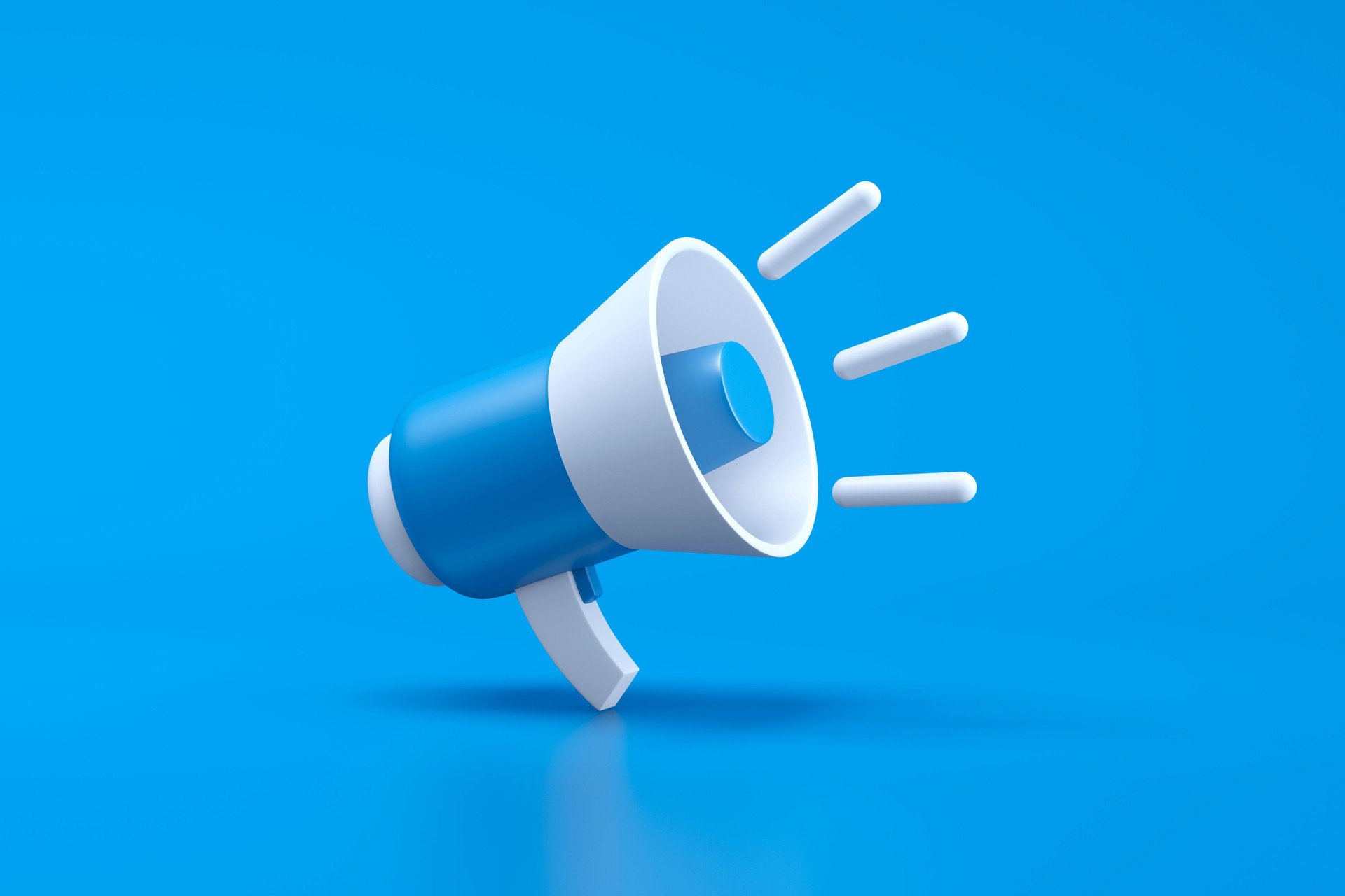 Single blue and white electric megaphone with a handle stands on a blue background